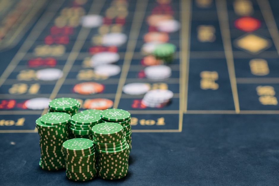 A stack of green tokens on a table